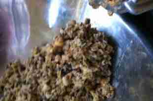 Grinding ingredients for frozen fish food.