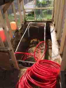 Water circulates from a solar heater into the thermal mass to release warmth at night.